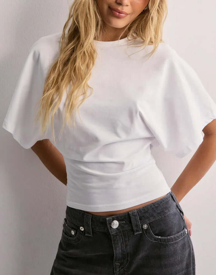 T-shirt à manches chauve-souris Neia studio, disponible en plusieurs couleurs, style décontracté et confortable.